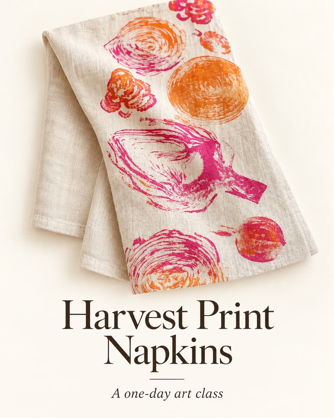 A folded linen napkin printed with pink and orange vegetable prints