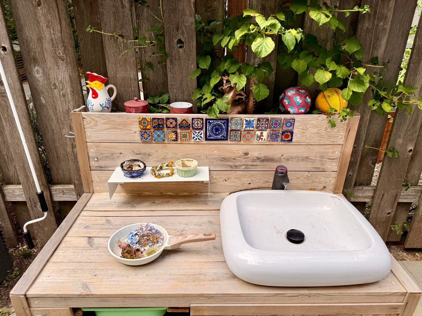 The outdoor mud kitchen sink, set up for hands-on play