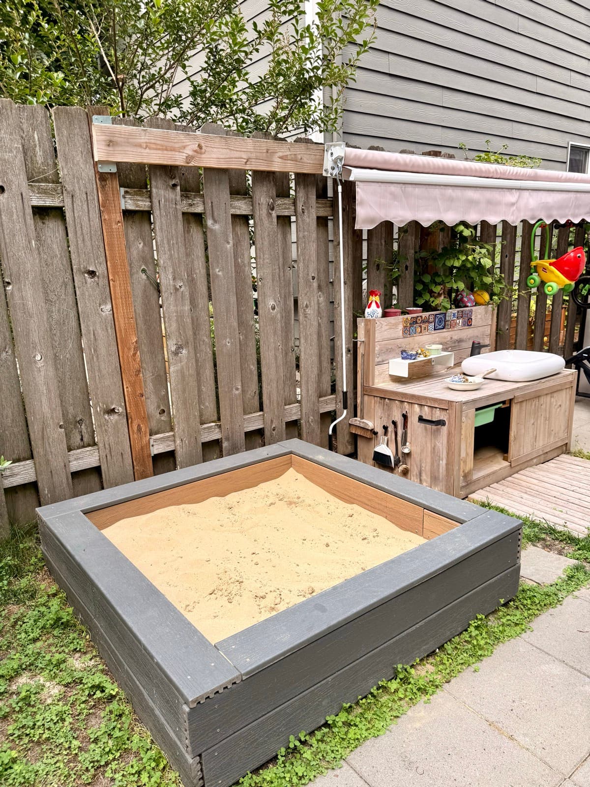 The outdoor sandbox and mud kitchen